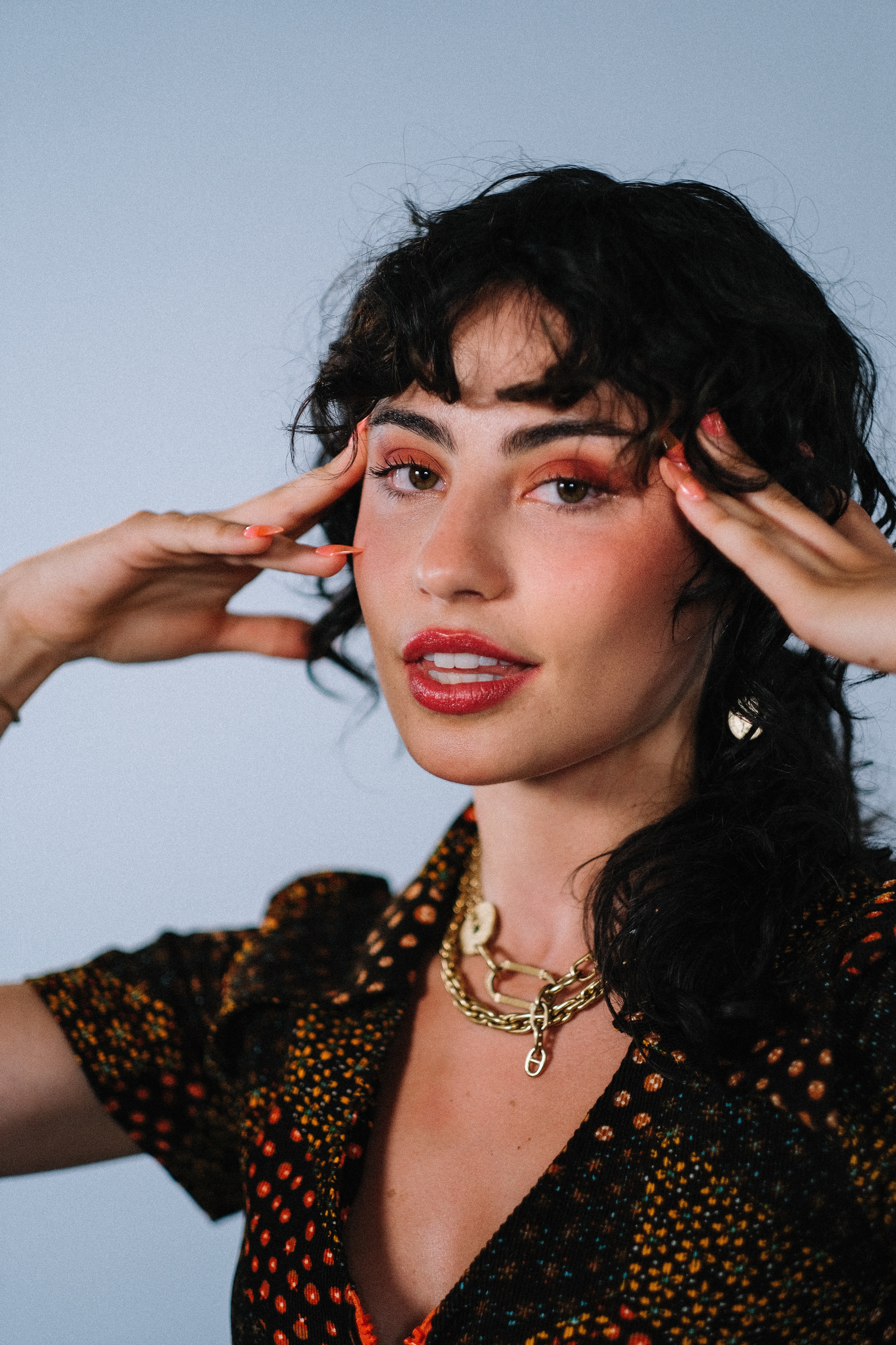 woman wearing makeup and necklace